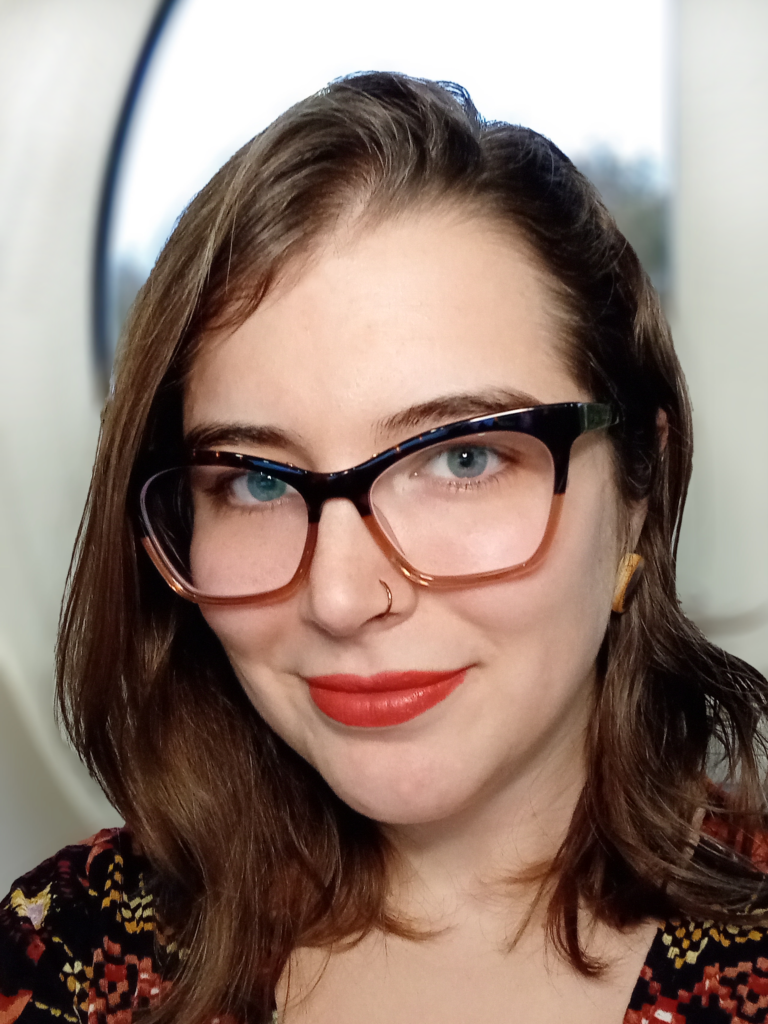 photo of Michelle Heath, a white woman with brown hair wearing cat-eye glasses